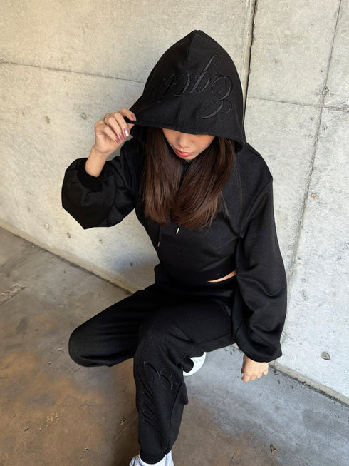 フードロゴラメ裏毛トップス