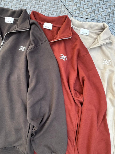 EGロゴ刺繍ハーフジップトップス